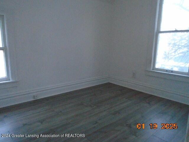 empty room featuring dark hardwood / wood-style floors