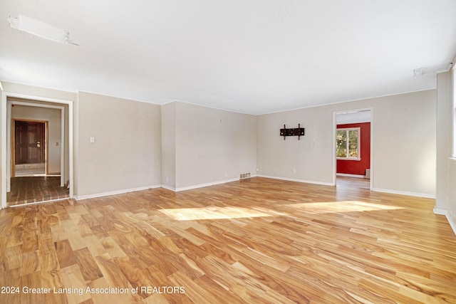 unfurnished room with light hardwood / wood-style floors