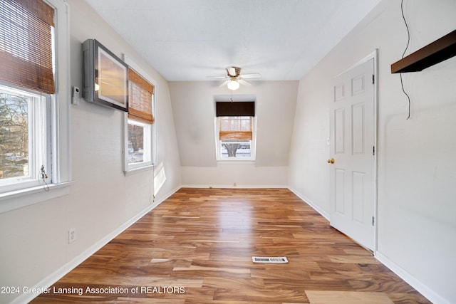 interior space with hardwood / wood-style flooring and ceiling fan