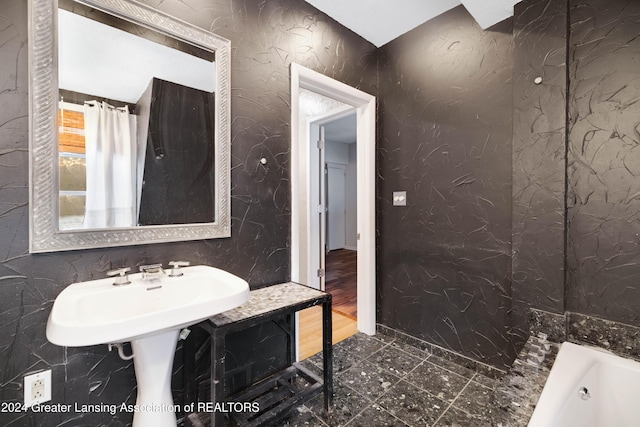 bathroom with a tub to relax in