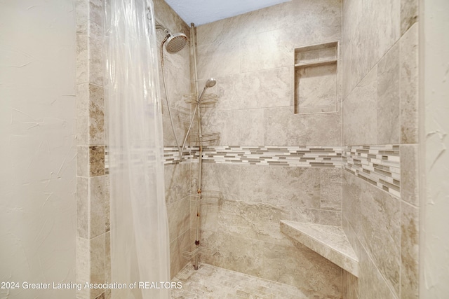 bathroom featuring curtained shower