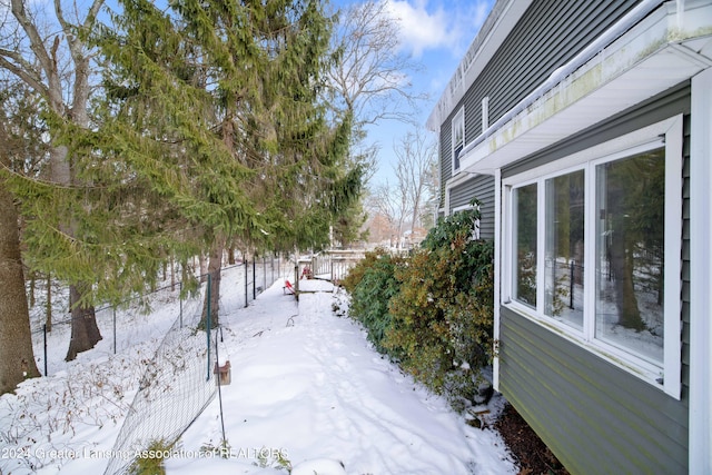 view of yard layered in snow