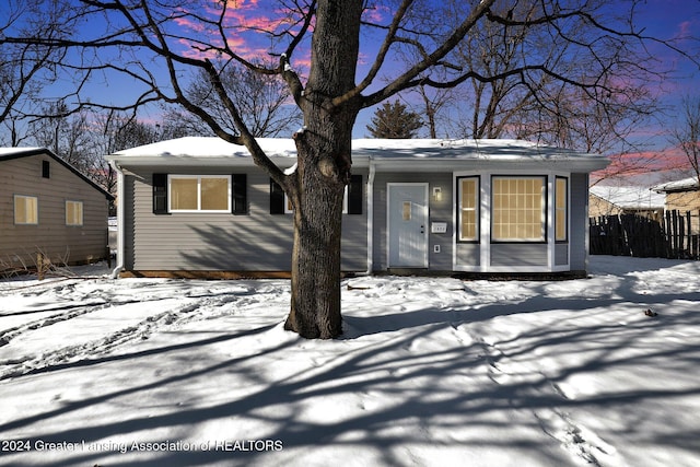 view of snow covered house