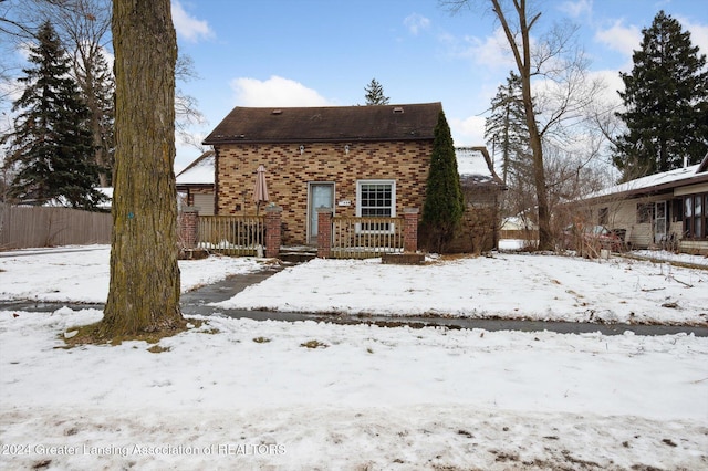 view of snow covered house