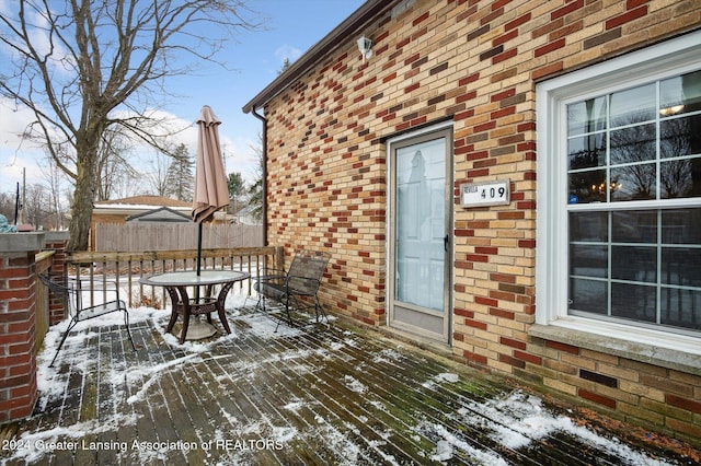 view of snow covered deck