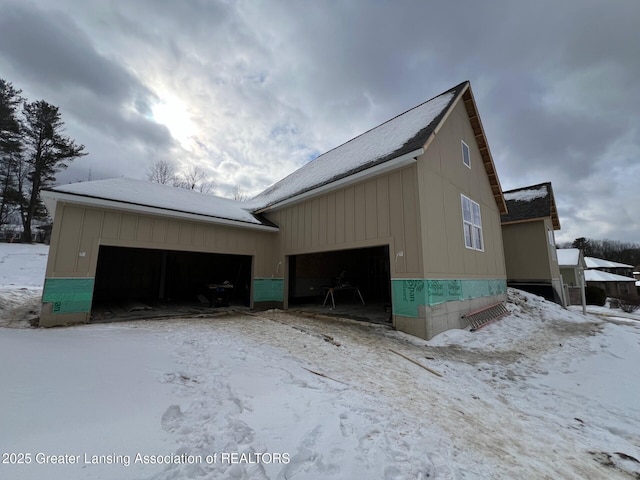 view of snow covered garage