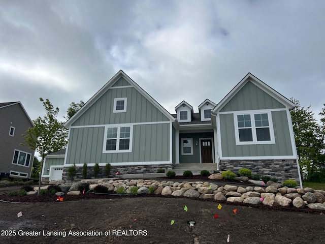 6097 Southridge Rd, East Lansing, MI 48823 - craftsman-style house featuring board and batten siding and stone siding