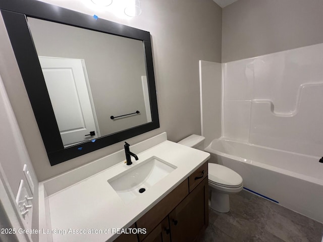 6097 Southridge Rd, East Lansing, MI 48823 - bathroom featuring toilet, vanity, and tub / shower combination