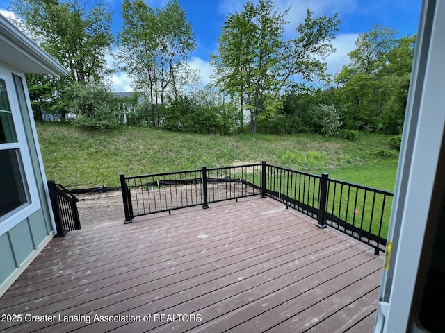 6097 Southridge Rd, East Lansing, MI 48823 - wooden terrace featuring a lawn