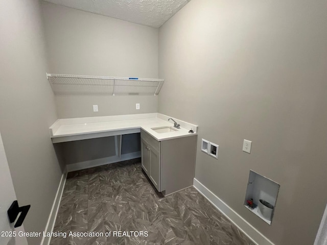 6097 Southridge Rd, East Lansing, MI 48823 - washroom featuring baseboards, hookup for a washing machine, cabinet space, and a textured ceiling