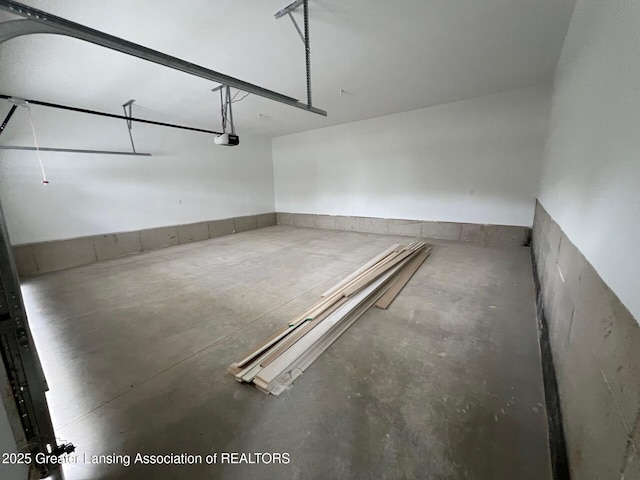 6097 Southridge Rd, East Lansing, MI 48823 - garage featuring a garage door opener