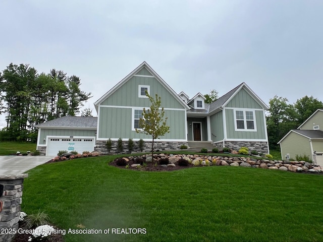 6097 Southridge Rd, East Lansing, MI 48823 - craftsman inspired home with board and batten siding, a front lawn, and stone siding