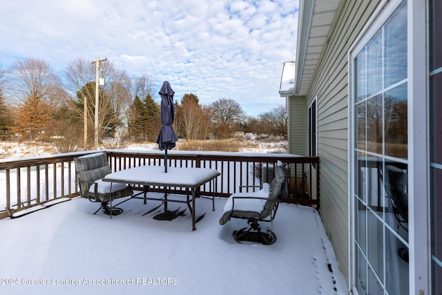 view of snow covered deck