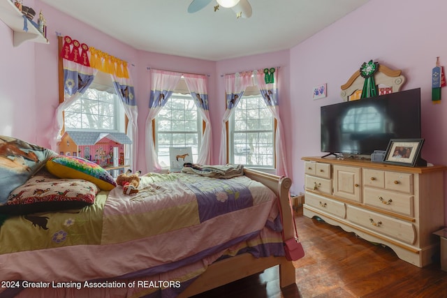 bedroom with hardwood / wood-style flooring and ceiling fan