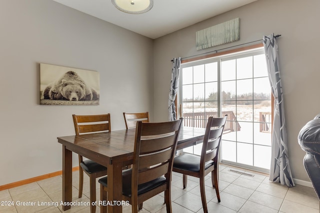 dining room featuring light tile patterned flooring