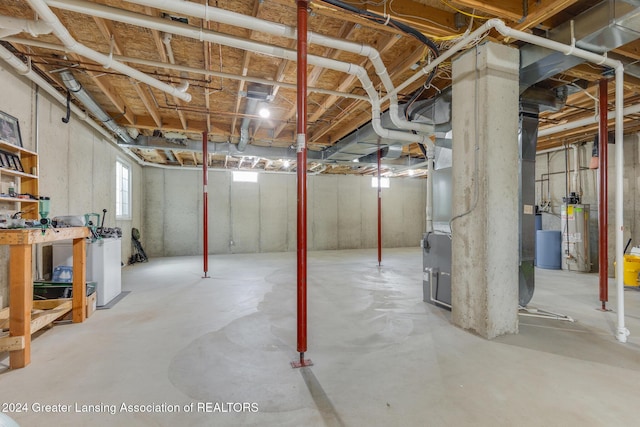 basement with heating unit and water heater