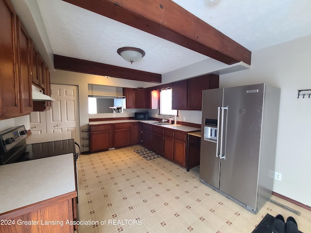 kitchen featuring appliances with stainless steel finishes, sink, and beamed ceiling