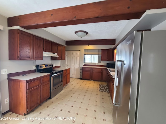 kitchen featuring beam ceiling and stainless steel appliances