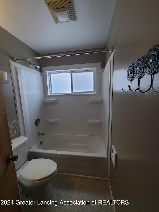 bathroom featuring toilet and shower / bath combination