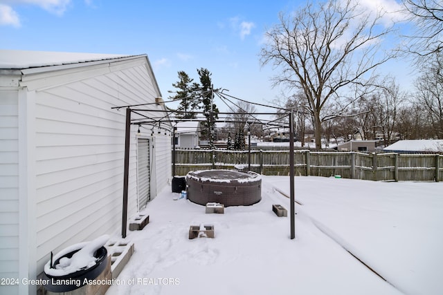 view of yard layered in snow