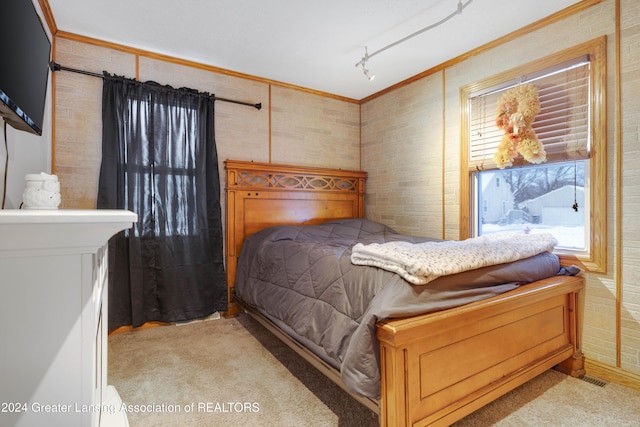 carpeted bedroom featuring crown molding