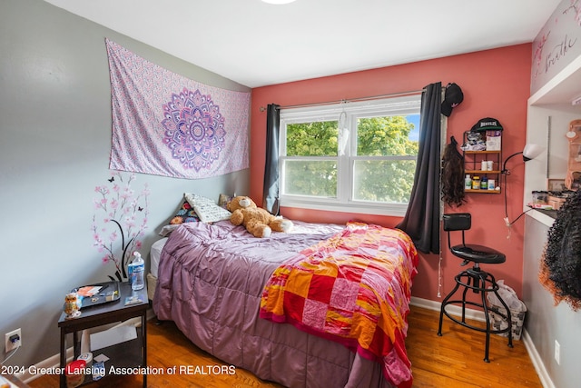 bedroom featuring hardwood / wood-style flooring