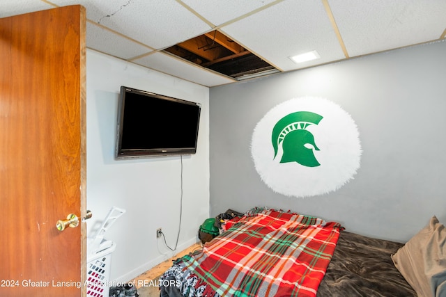 bedroom with a paneled ceiling