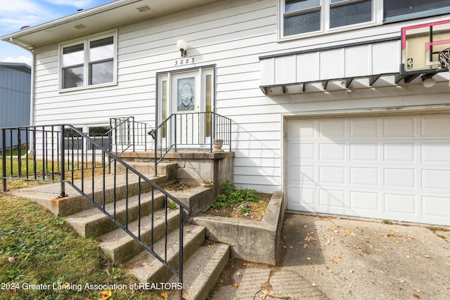 property entrance featuring a garage