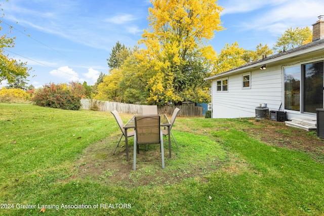 view of yard featuring central AC