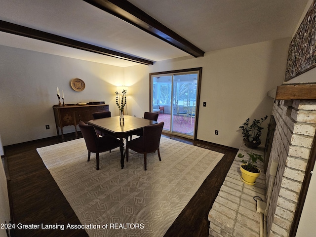 dining room featuring beamed ceiling and dark wood-type flooring