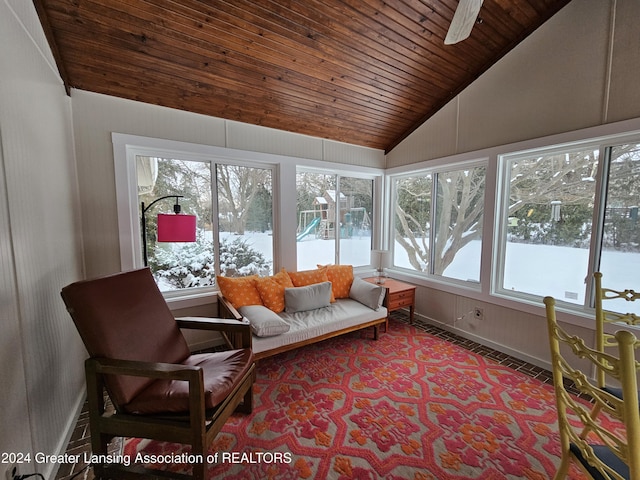 sunroom featuring vaulted ceiling, ceiling fan, and wood ceiling