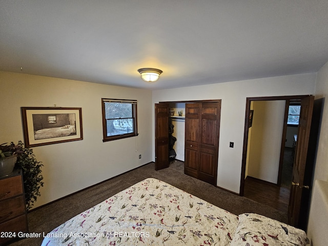 bedroom featuring dark carpet