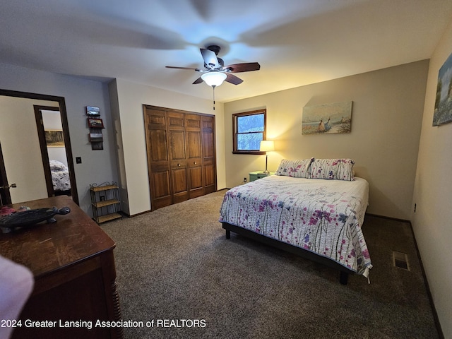 bedroom featuring ceiling fan, a closet, and dark colored carpet