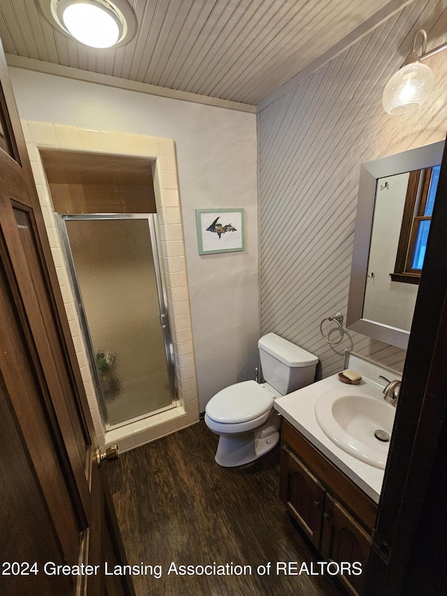 bathroom with toilet, wooden ceiling, hardwood / wood-style flooring, vanity, and a shower with door