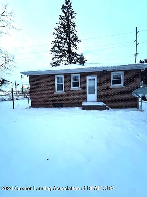 view of front of house with brick siding