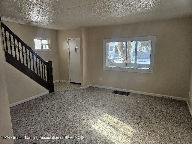 entrance foyer with a textured ceiling