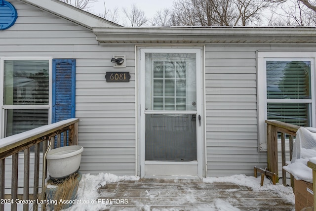 doorway to property featuring a deck