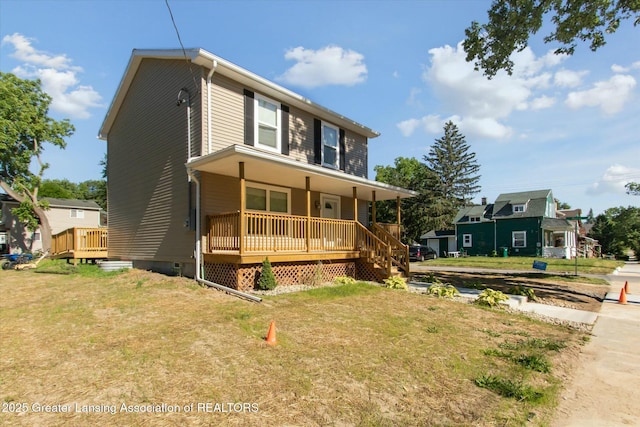 view of front of property with covered porch and a front lawn