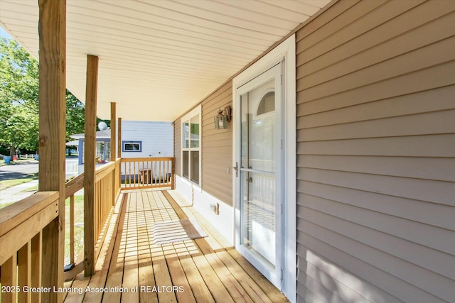 wooden terrace with a porch