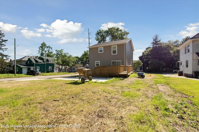 exterior space featuring a yard and a deck