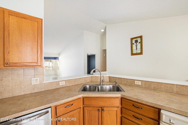 kitchen with sink, dishwasher, white dishwasher, and lofted ceiling