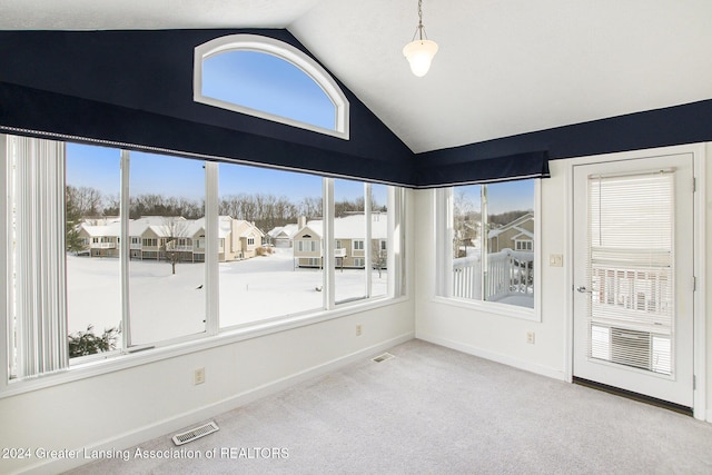 unfurnished sunroom with a healthy amount of sunlight and lofted ceiling