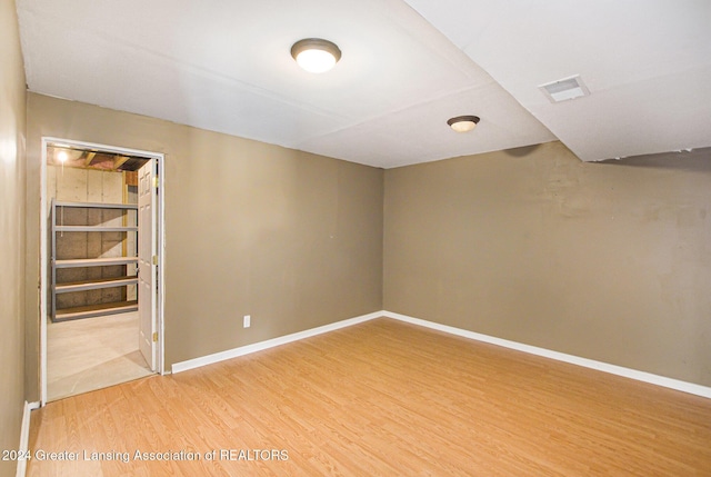 unfurnished room featuring hardwood / wood-style floors