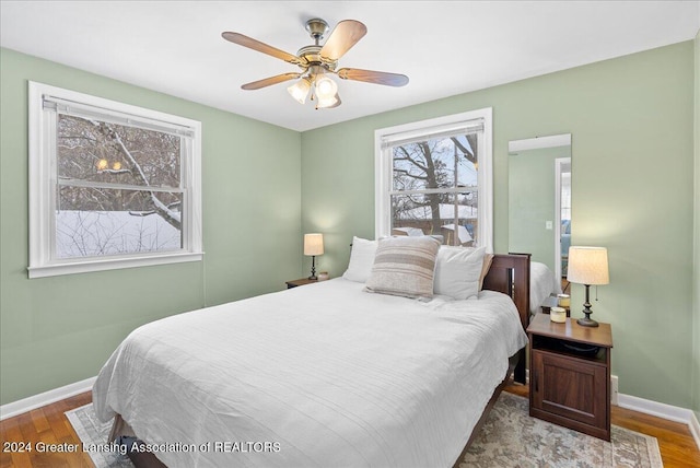 bedroom featuring wood-type flooring and ceiling fan