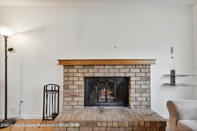 interior details with a brick fireplace