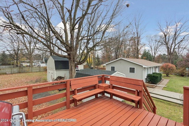 wooden deck featuring a storage shed