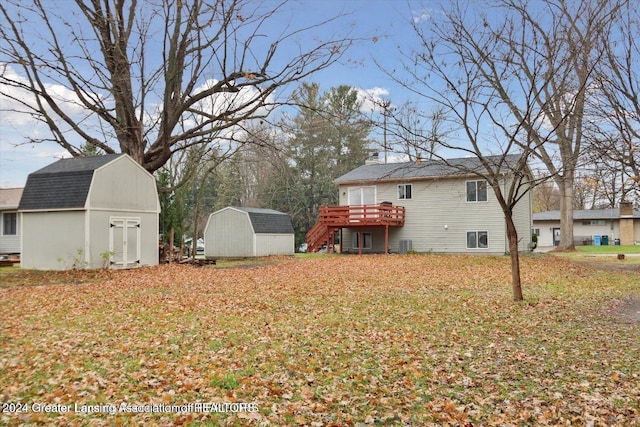 view of yard with a storage shed and a deck