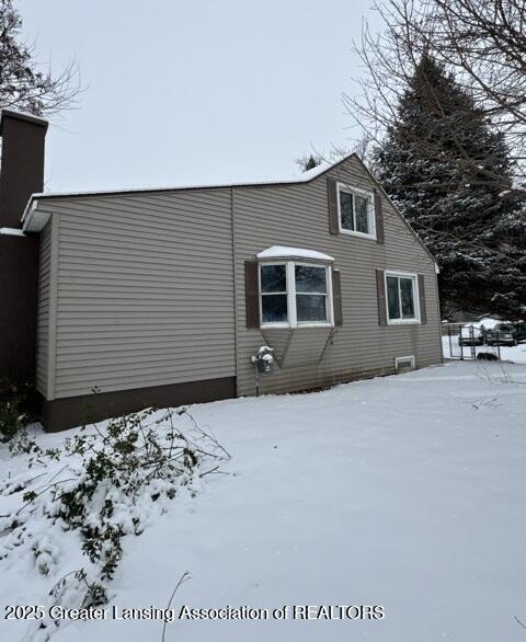 view of snow covered property