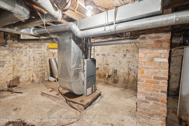 basement with water heater and heating unit