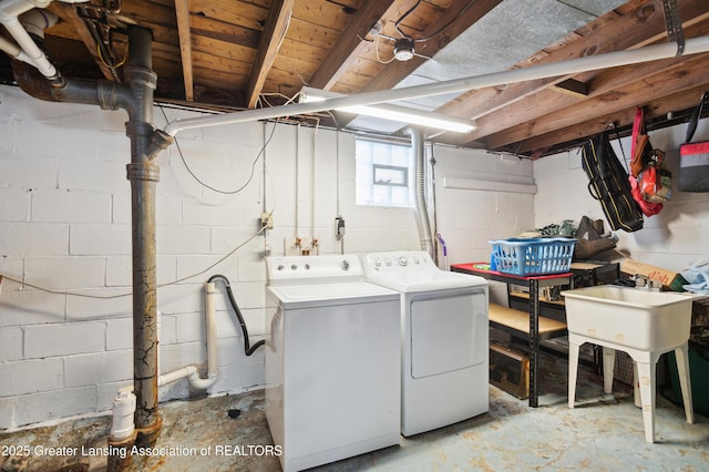 clothes washing area with independent washer and dryer